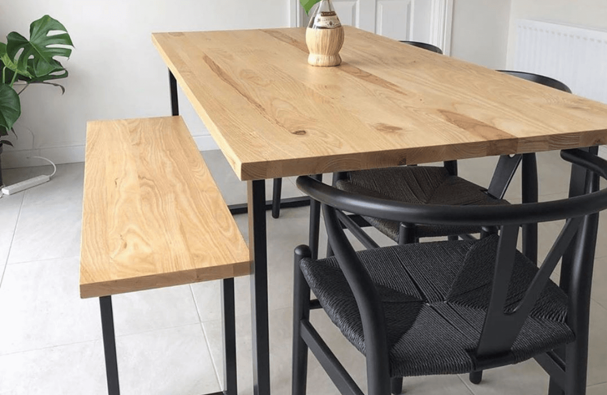 Wooden table with chairs and a bench next to it
