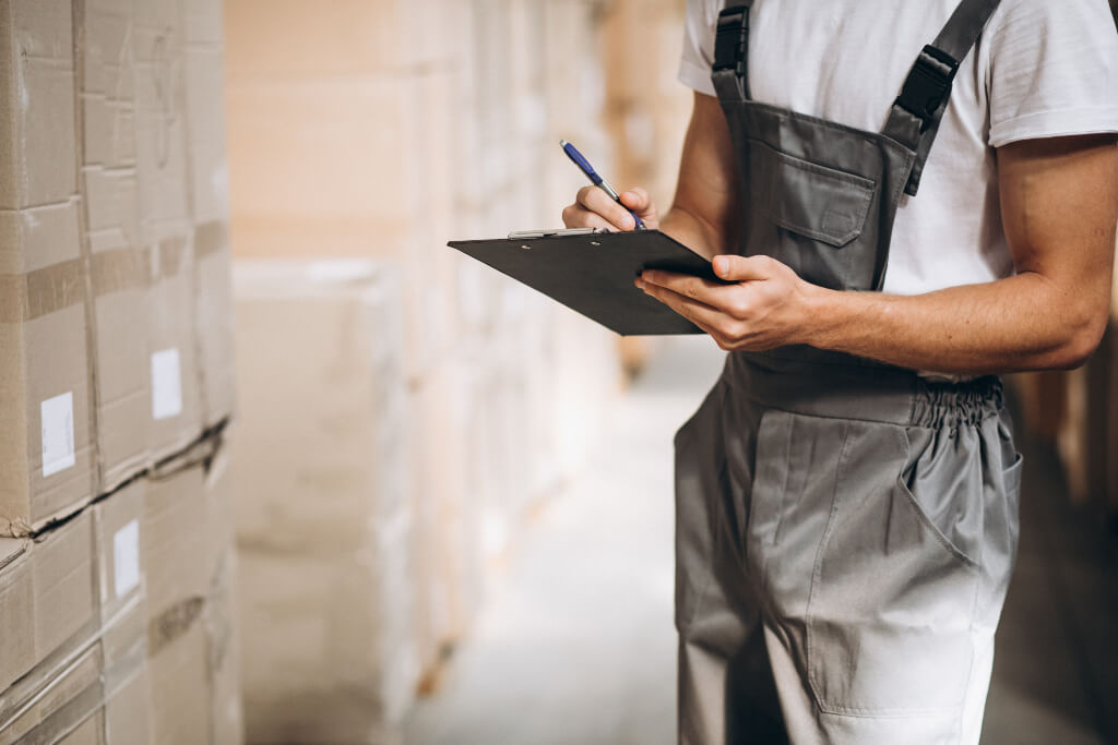 Supply chain manager taking notes