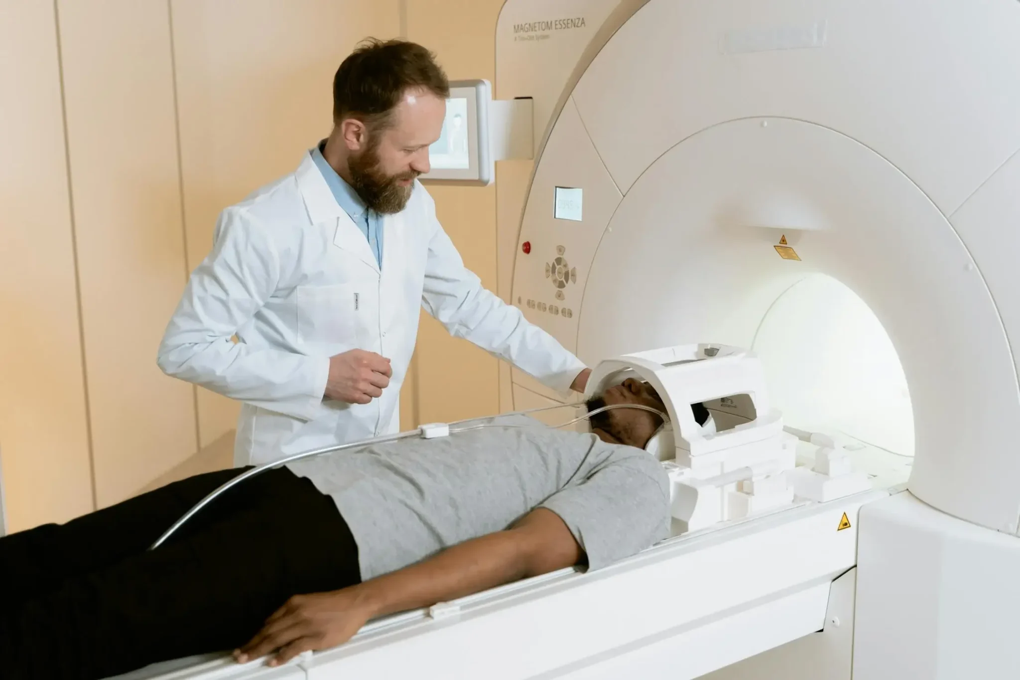 Doctor giving a man a MRI scan
